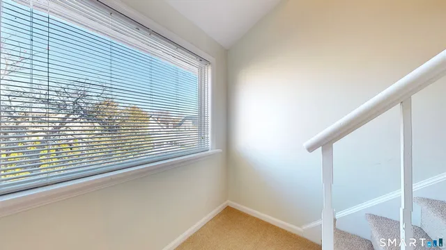 a view of a room that has a window in it