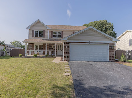 7 Boulder Ridge Court Bolingbrook, IL 60490 - Photo 1 of 44 a front view of a house with a garden and yard