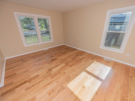7 Boulder Ridge Court Bolingbrook, IL 60490 - Photo 11 of 44 a view of an empty room with wooden floor and a window