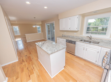 7 Boulder Ridge Court Bolingbrook, IL 60490 - Photo 17 of 44 a kitchen with a sink stove and cabinets