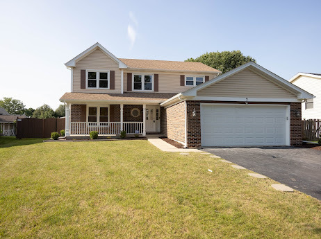 7 Boulder Ridge Court Bolingbrook, IL 60490 - Photo 2 of 44 a front view of a house with a yard