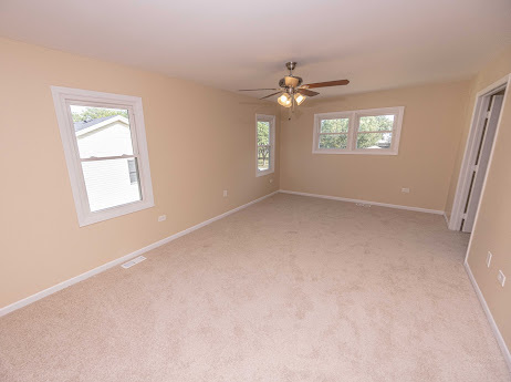 7 Boulder Ridge Court Bolingbrook, IL 60490 - Photo 34 of 44 an empty room with windows and fan