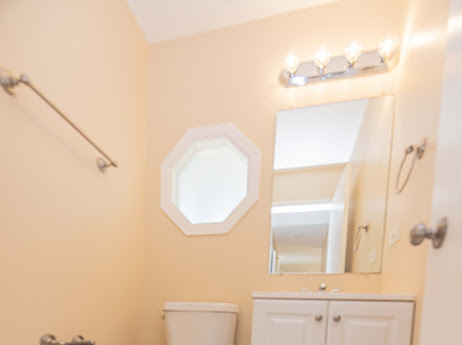 7 Boulder Ridge Court Bolingbrook, IL 60490 - Photo 10 of 44 a bathroom with a mirror and a sink