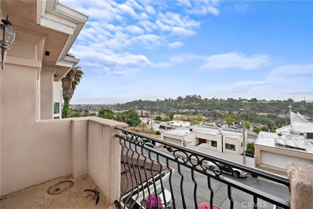a view of a balcony with city view