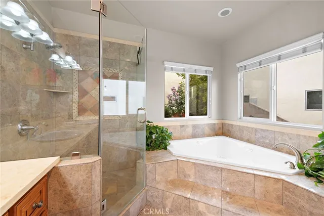 a bath tub sitting in a bathroom next to a window