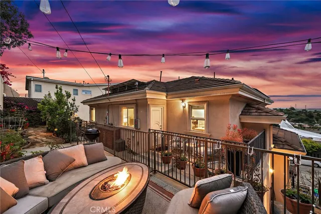 a view of a balcony with furniture