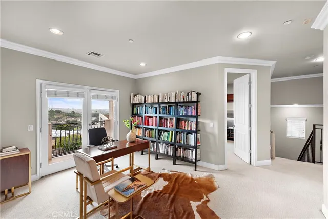 a living room with a couch and a book shelf