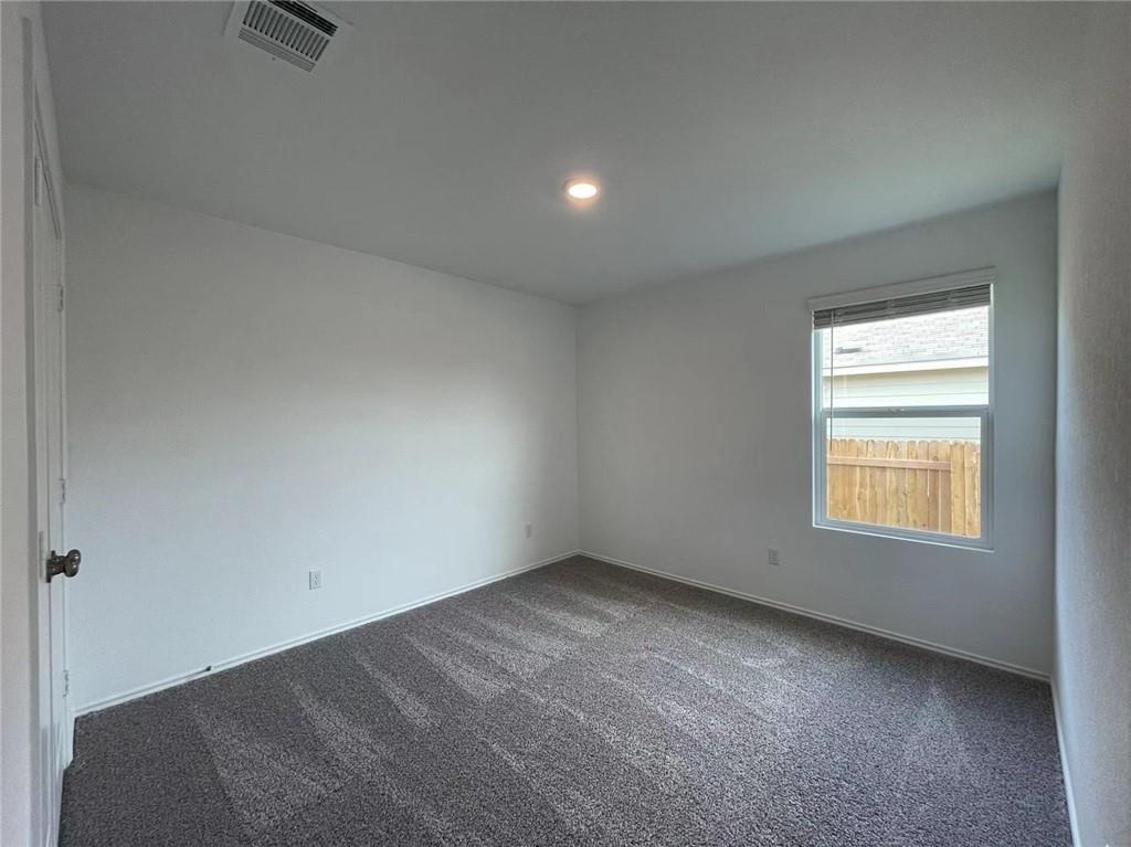 409 Bluejack Way Hutto, TX 78634 - Photo 15 of 28 an empty room with a window