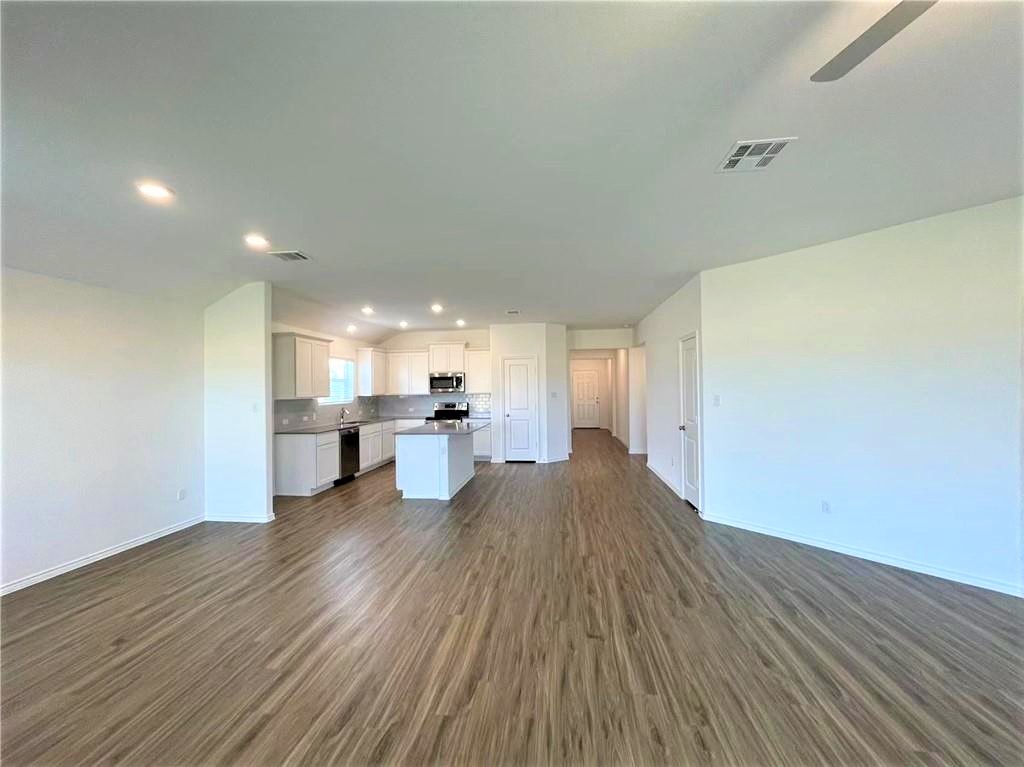 409 Bluejack Way Hutto, TX 78634 - Photo 28 of 28 a view of empty room with wooden floor