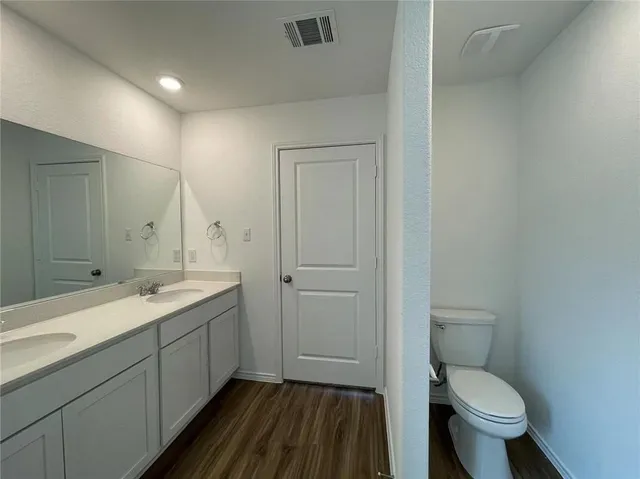 a bathroom with a bathtub and a sink