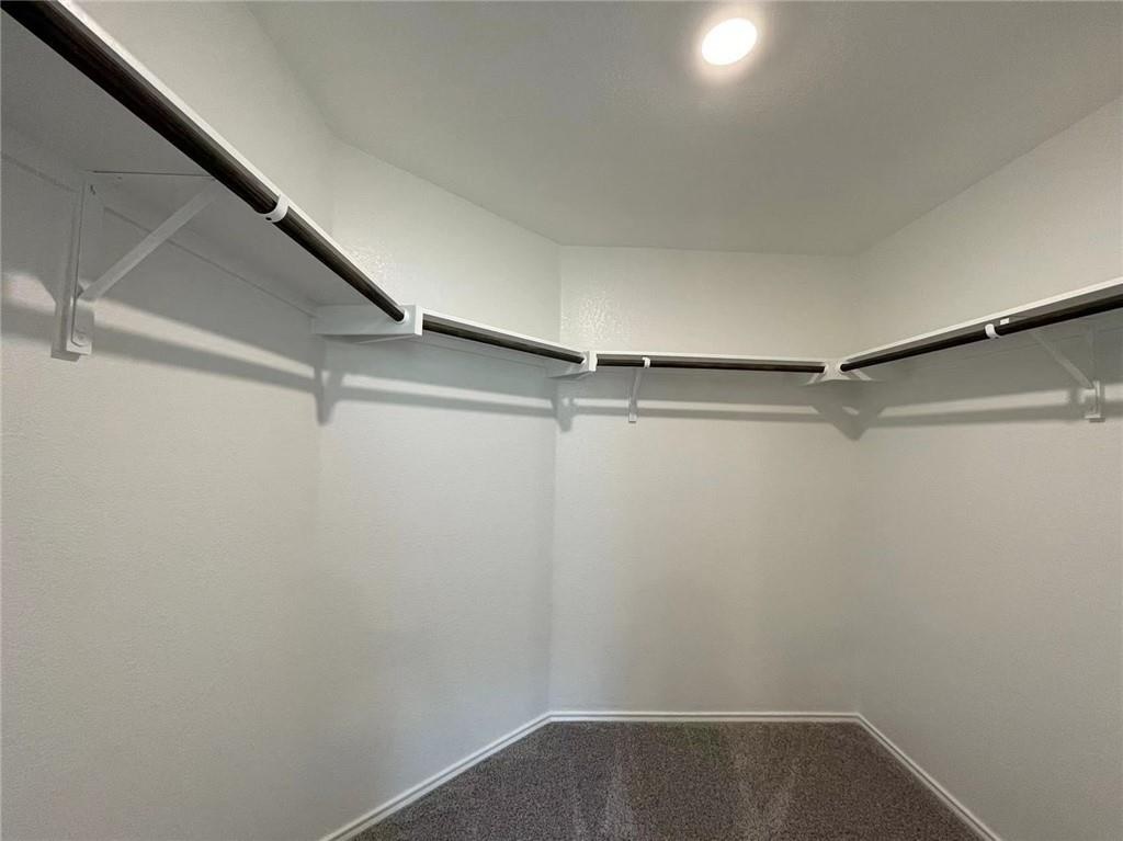 409 Bluejack Way Hutto, TX 78634 - Photo 24 of 28 a view of a room with racks on the wall