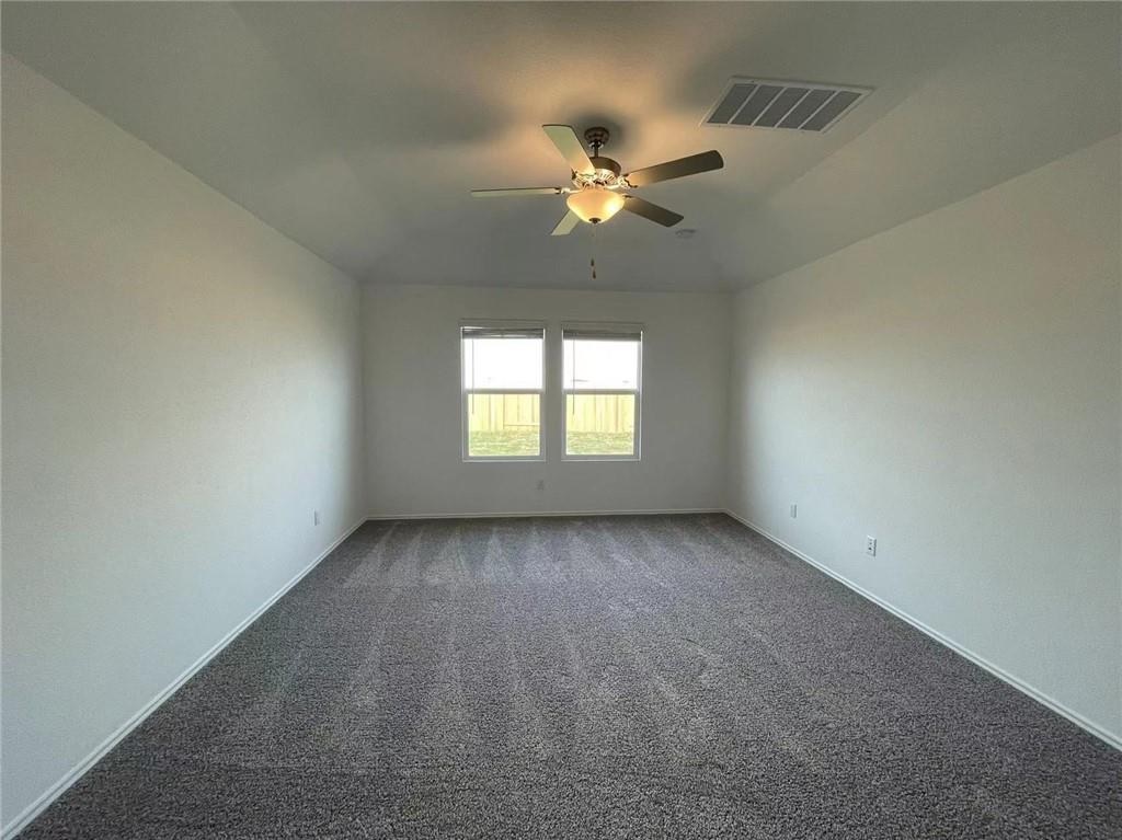 409 Bluejack Way Hutto, TX 78634 - Photo 25 of 28 a view of an empty room with a window