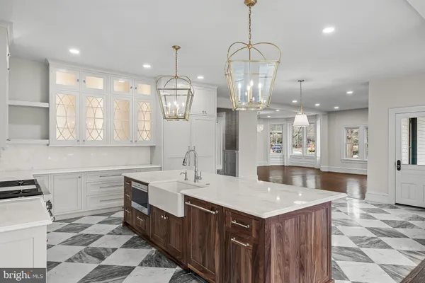 a kitchen with a sink a counter top space and appliances