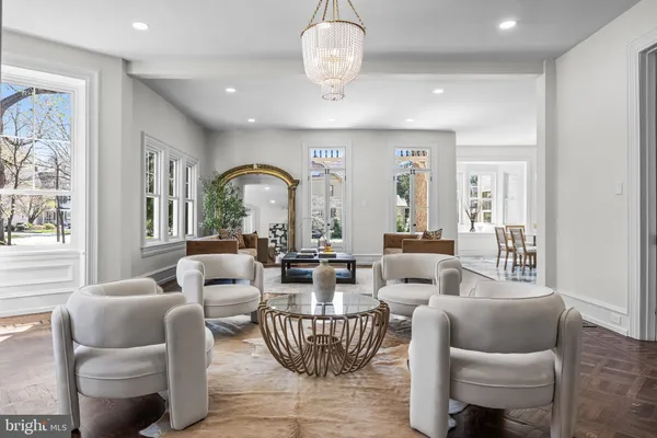 a view of a dining room with furniture and chandelier