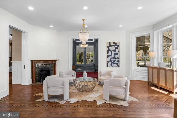 a bathroom with a granite countertop sink and a toilet
