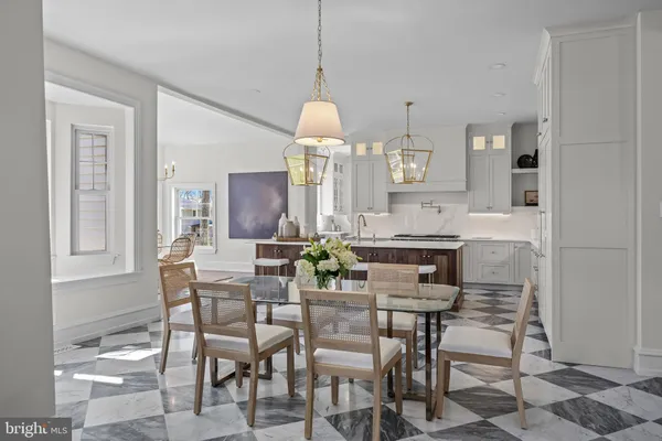 a living room with furniture chess table and a window