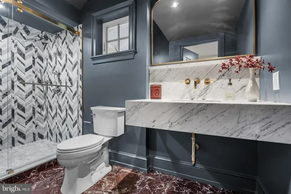 a living room with furniture a rug and a large window