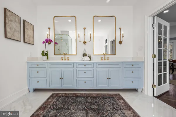 a front view of a house with a yard table and chairs