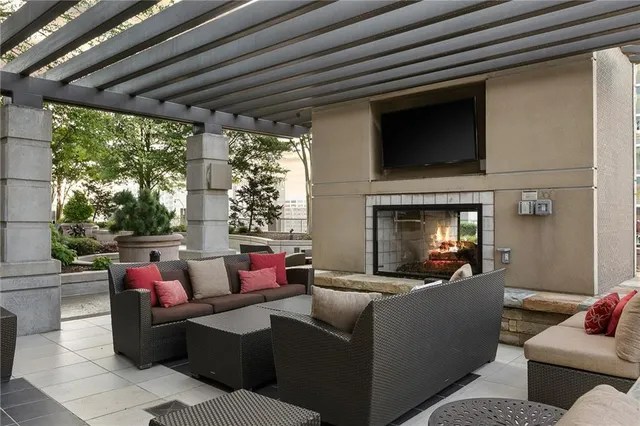 a view of a patio with a table and chairs