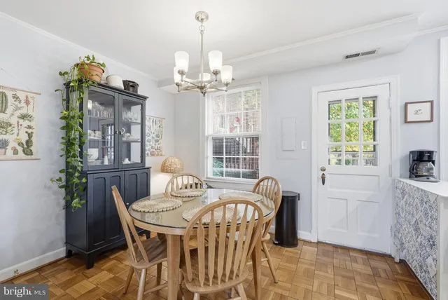 a view of a dining room with furniture window and outside view