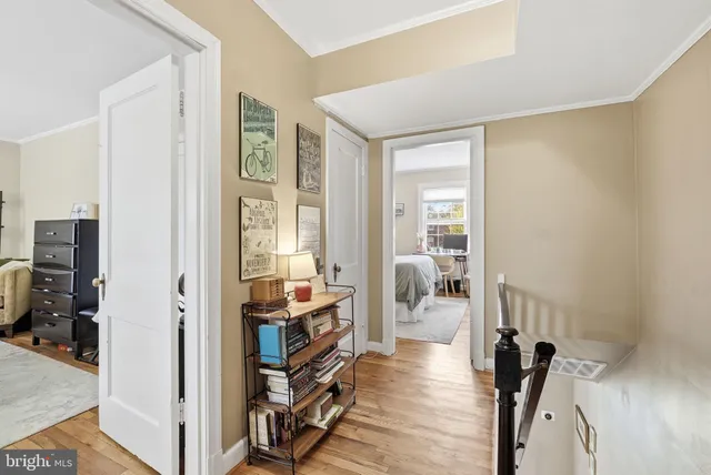 a view of a livingroom with furniture and hardwood floor