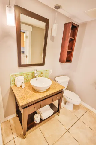 a bathroom with a sink vanity and a mirror