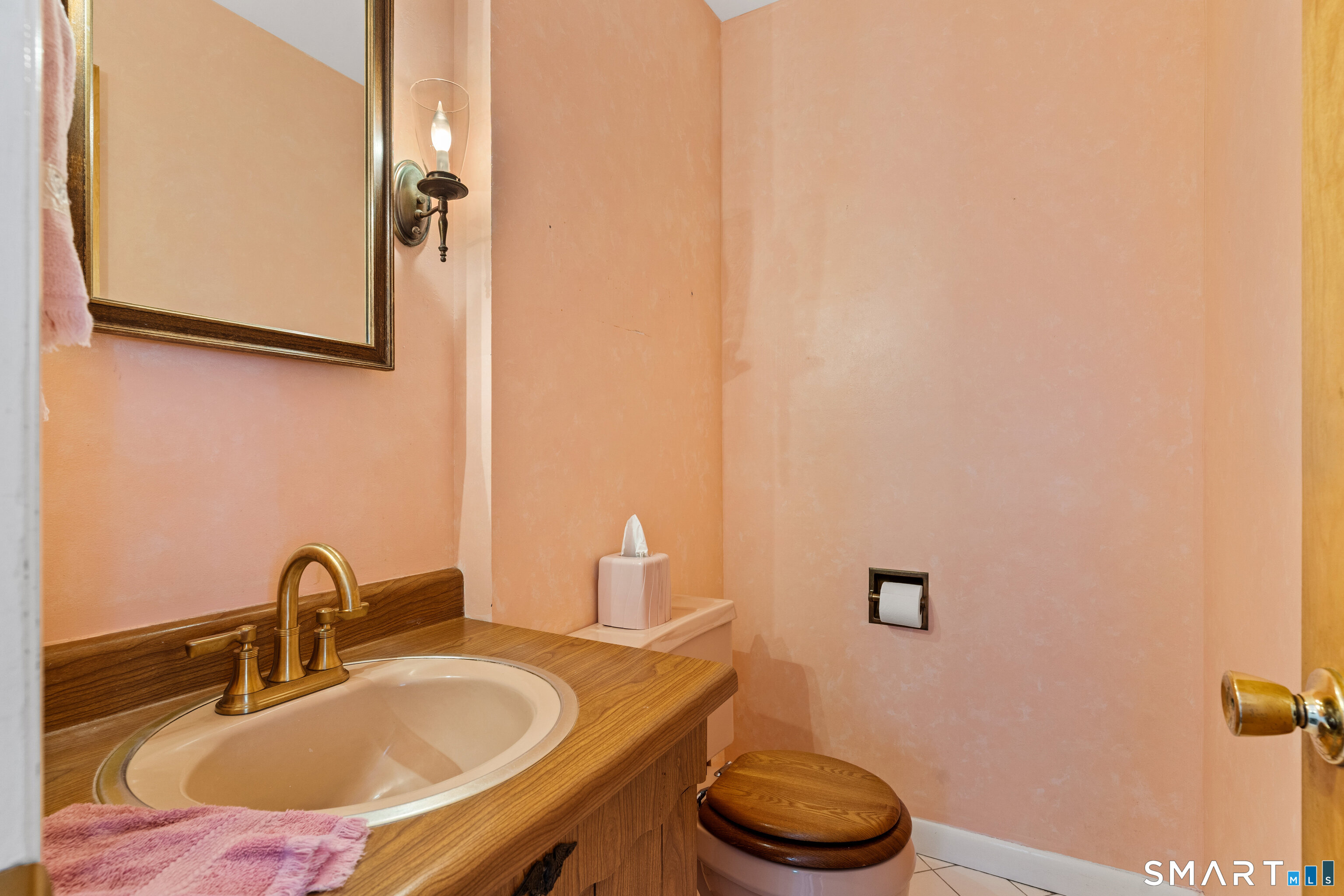 251 Shelter Rock Road Fairfield, CT 06825 - Photo 18 of 38 a bathroom with a granite countertop toilet sink and mirror