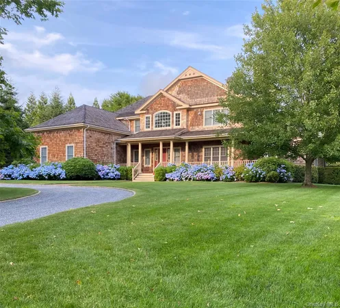 front view of a house next to a yard