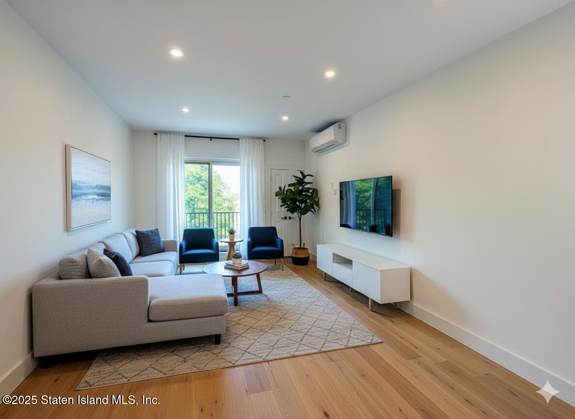 3865 Amboy Road, Unit 3D Staten Island, NY 10308 - Photo 2 of 36 a living room with furniture and a flat screen tv