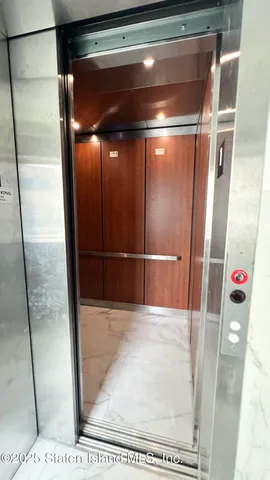 a view of a patio with a table and chairs