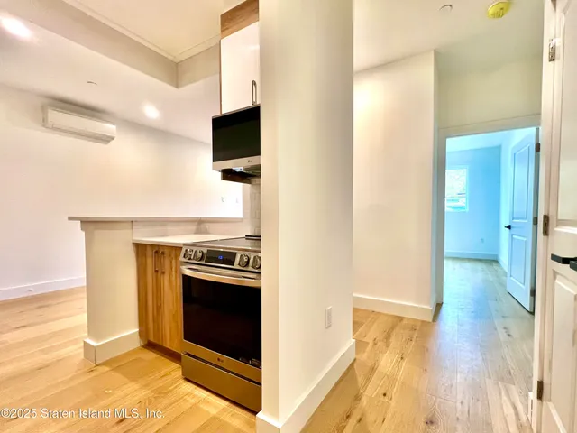 a view of a kitchen with a sink and a stove
