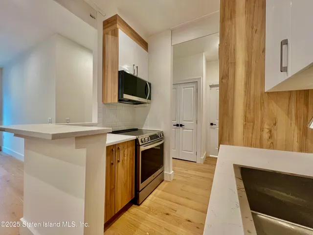 a kitchen with a stove and a microwave