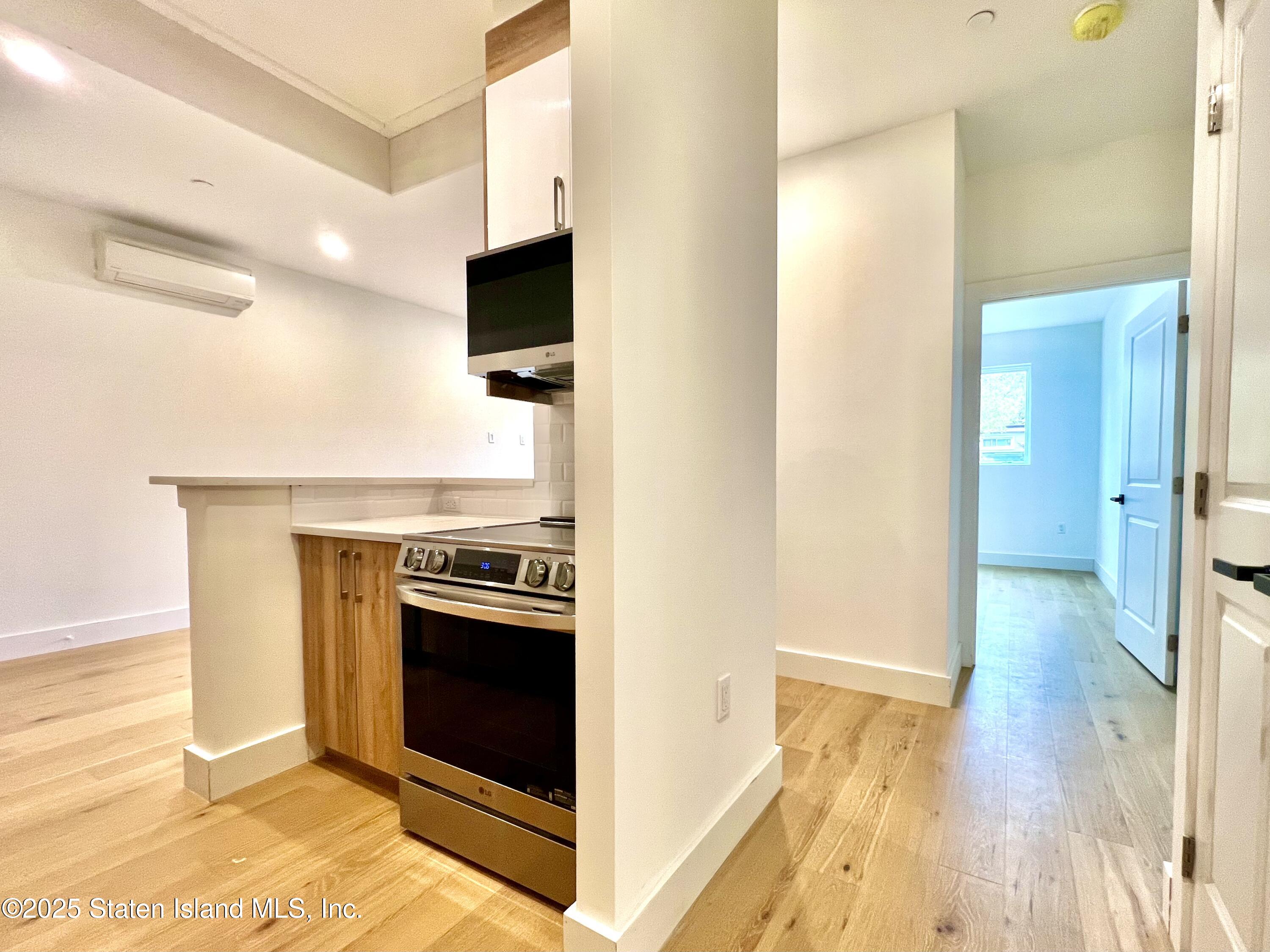 3865 Amboy Road, Unit 3D Staten Island, NY 10308 - Photo 8 of 36 a view of a kitchen with a sink and a stove