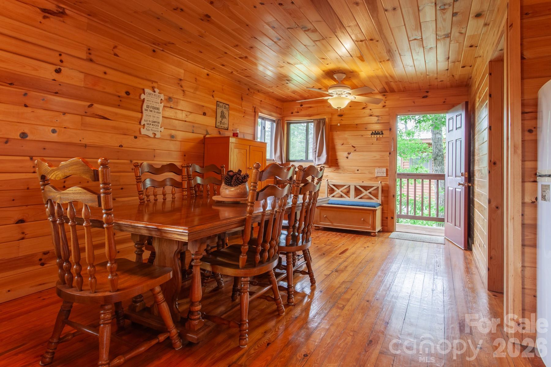 307 Blue Ridge Parkway Bryson City, NC 28713 - Photo 28 of 48 a view of a patio with table and chairs with wooden floor and fence