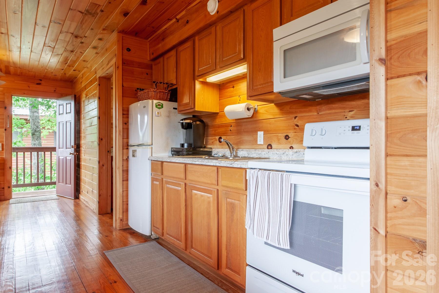 307 Blue Ridge Parkway Bryson City, NC 28713 - Photo 29 of 48 a kitchen with stainless steel appliances a refrigerator and cabinets