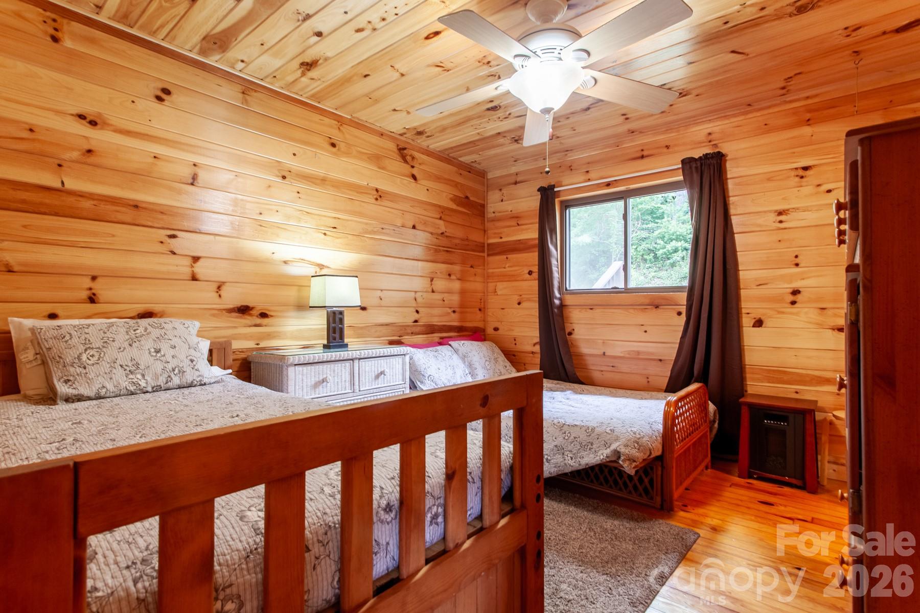 307 Blue Ridge Parkway Bryson City, NC 28713 - Photo 35 of 48 a bedroom with furniture and a window