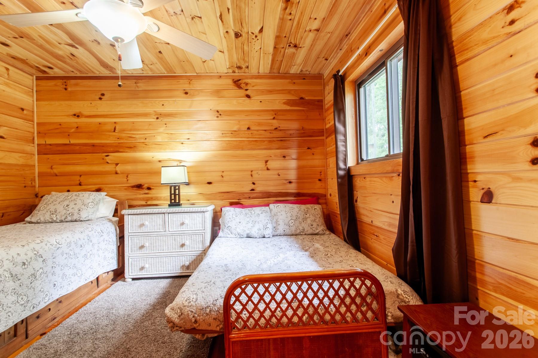 307 Blue Ridge Parkway Bryson City, NC 28713 - Photo 37 of 48 a bedroom with a bed and window