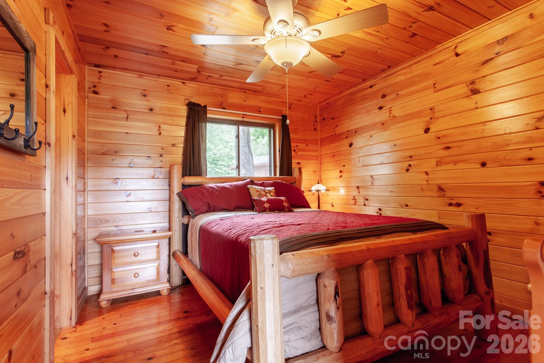 307 Blue Ridge Parkway Bryson City, NC 28713 - Photo 43 of 48 a bedroom with a bed and a dresser