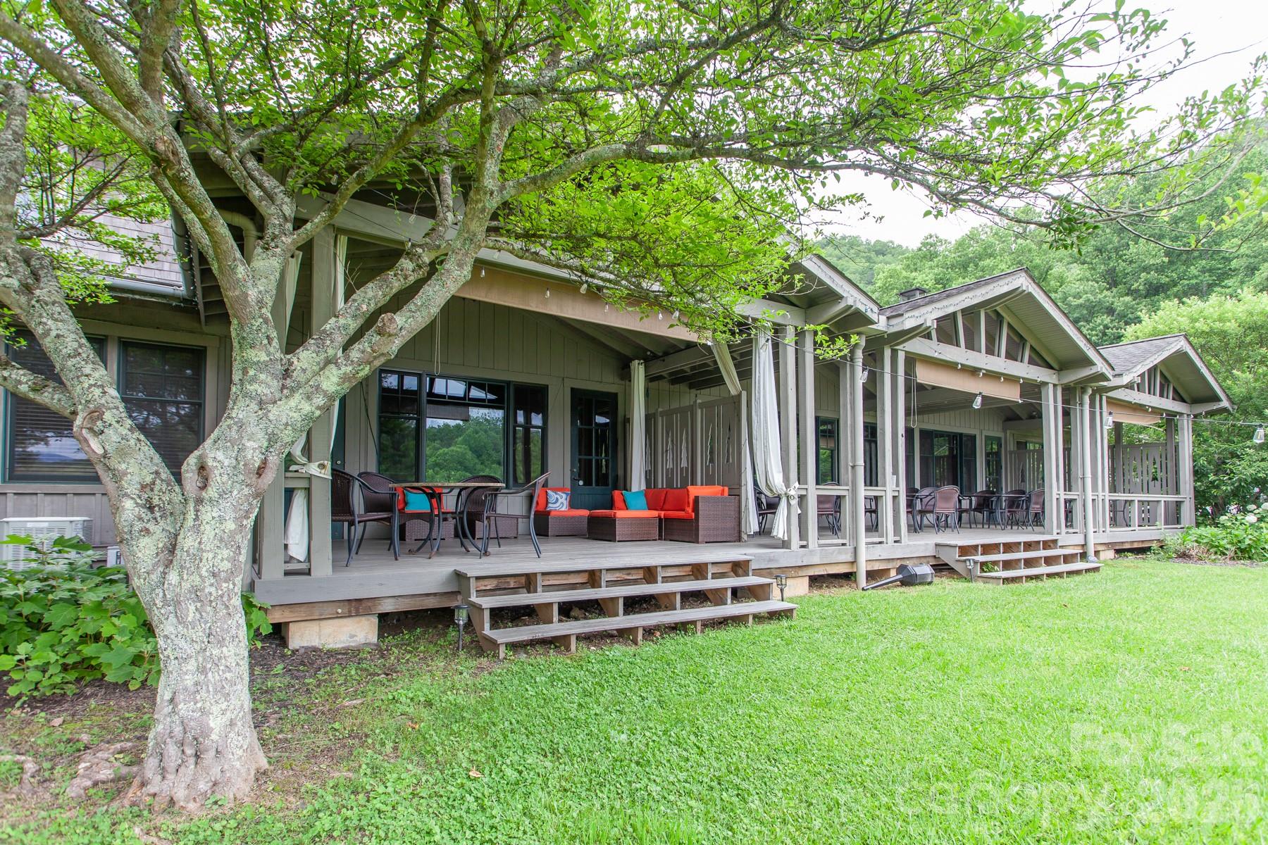 307 Blue Ridge Parkway Bryson City, NC 28713 - Photo 45 of 48 a view of a house with a backyard porch and sitting area