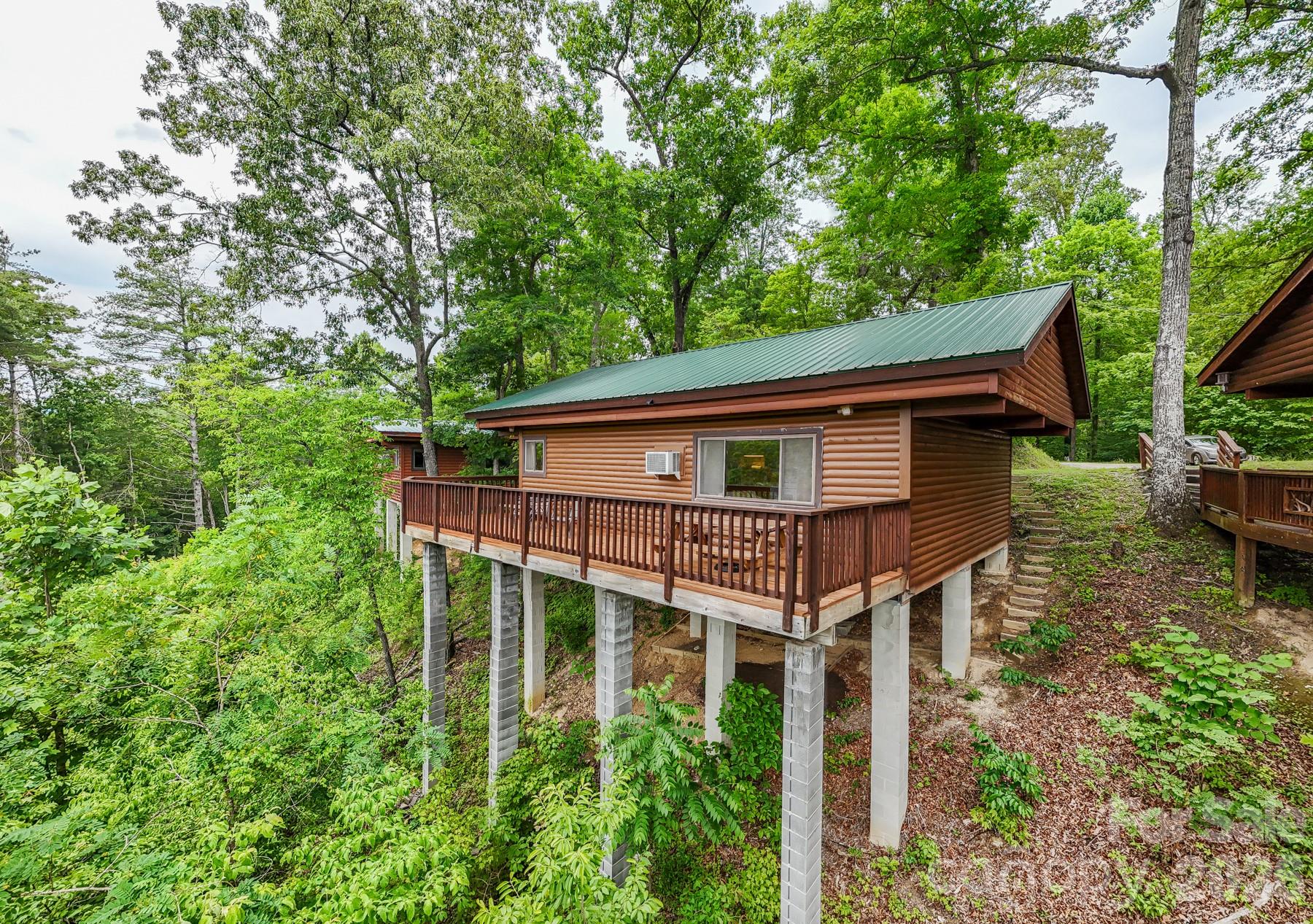 307 Blue Ridge Parkway Bryson City, NC 28713 - Photo 5 of 48 a house that has tree in front of it