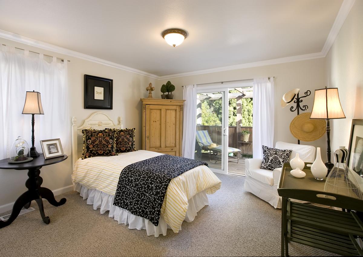 122 Hermosillo Road Santa Barbara, CA 93108 - Photo 5 of 6 a bedroom with a bed a lamp and a large window