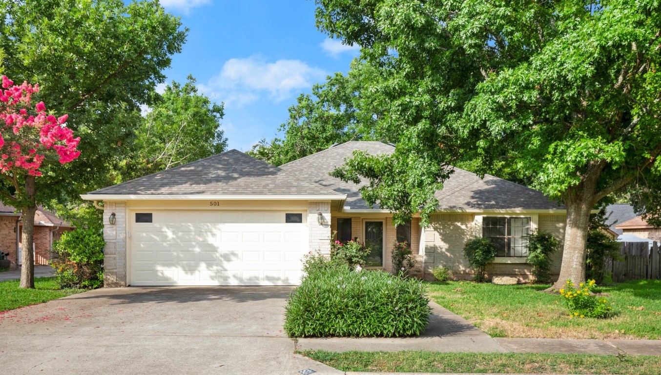 501 Oak Ridge Drive Pflugerville, TX 78660 - Photo 1 of 1 a front view of a house with garden