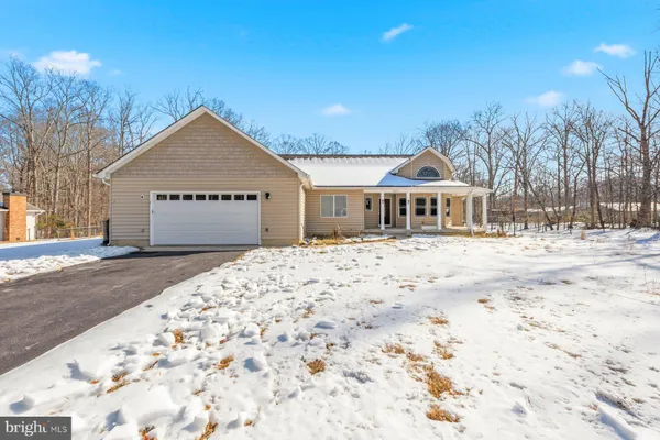 a front view of a building with a yard