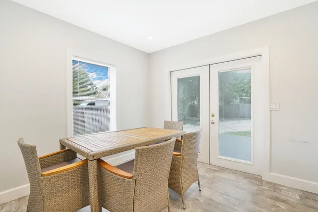 a dining room with a table and chairs