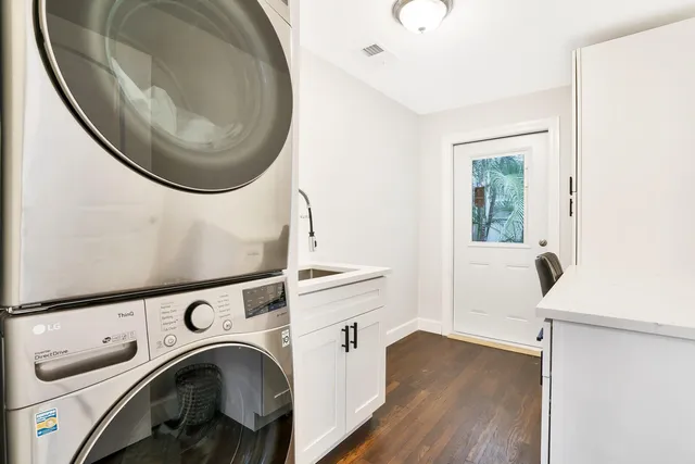 a view of a hallway with washer and dryer