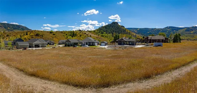 a view of a house with a big yard