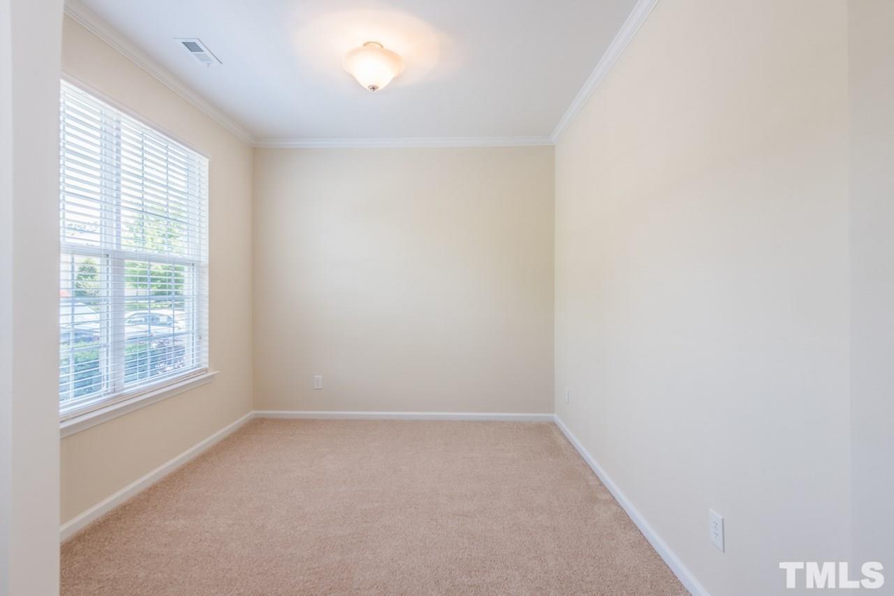 3535 Sugar Tree Place Durham, NC 27713 - Photo 3 of 8 an empty room with a window