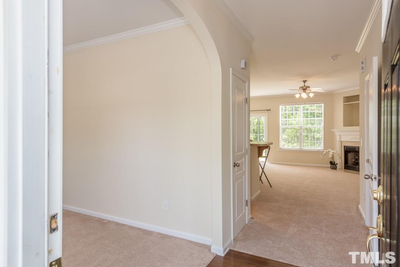 3535 Sugar Tree Place Durham, NC 27713 - Photo 4 of 8 a view of a hallway with furniture and chandelier