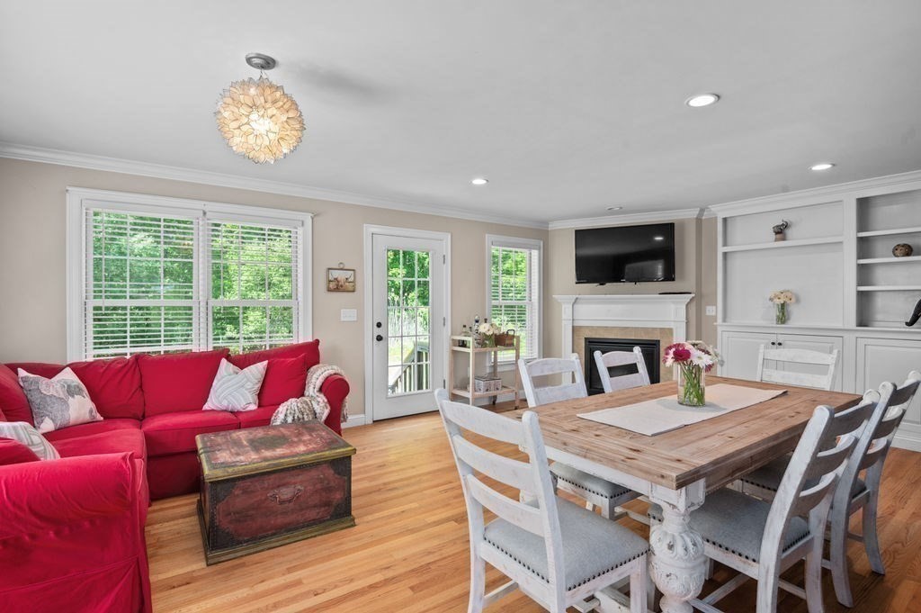 1 Timber Lane, Unit B Amesbury, MA 01913 - Photo 1 of 41 a living room with furniture a fireplace and a flat screen tv
