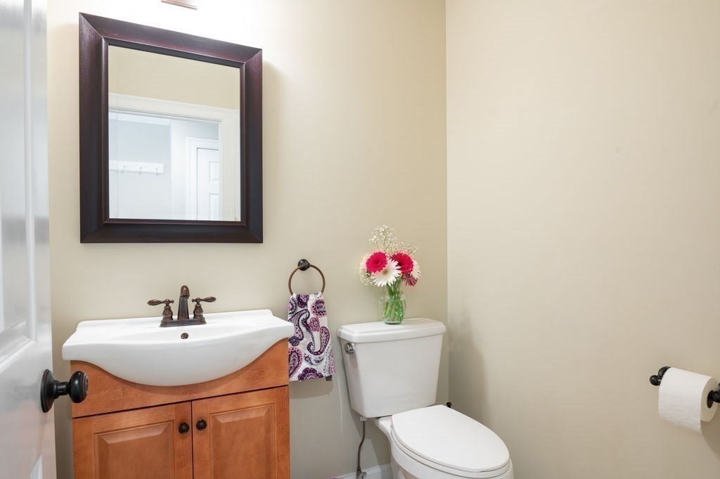 1 Timber Lane, Unit B Amesbury, MA 01913 - Photo 13 of 41 a bathroom with a sink mirror and toilet